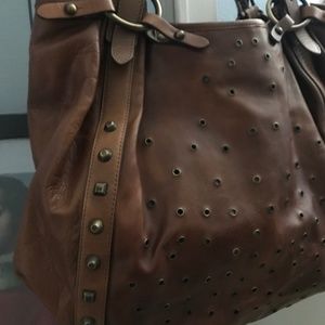 Stuart Weitzman leather grommet trimmed bag